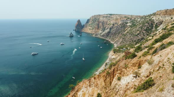 Aerial View of Calm Azure Sea and Volcanic Rocky Cliffs of Mys Fiolent alt