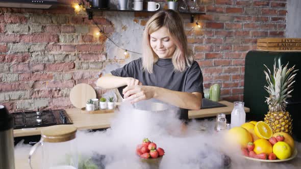 Young Woman with Loose Fair Hair Mixes Icecream and Talks