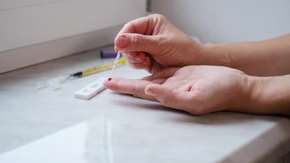 A woman doing a rapid test at home to determine the coronavirus, COVID 19