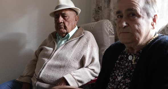 Elderly couple together at home alt