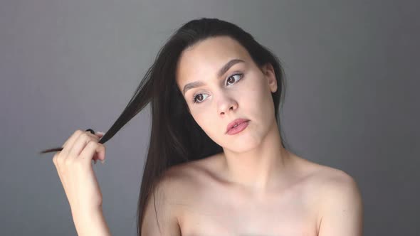 Pretty Young Female Caucasian Student Naked Shoulders Touch Lock Brunette Hair alt