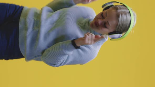 Woman Dancing with Headphones alt