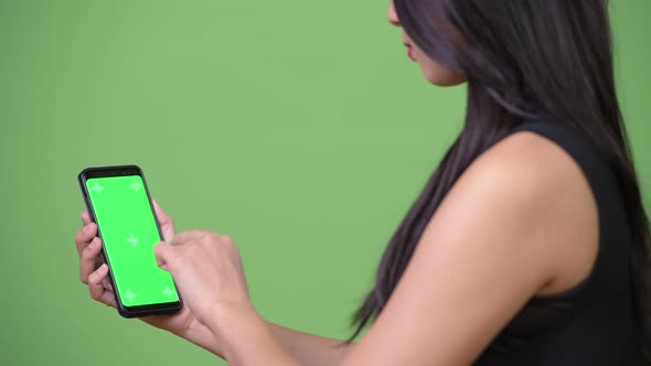 Young Beautiful Asian Businesswoman Showing Phone alt