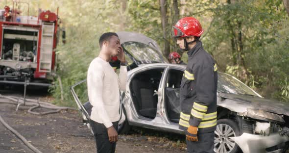 Firefighter Questioning Black Victim of Car Crash alt