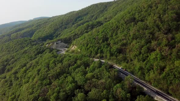 Cars Driving on Zig Zag Winding Mountain Road alt