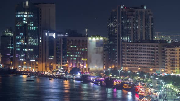 Dubai Creek Landscape Night Timelapse with Boats and Ship Near Waterfront alt