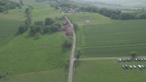 Sarremezan France Aerial rural landscape road green fields european village countryside summer