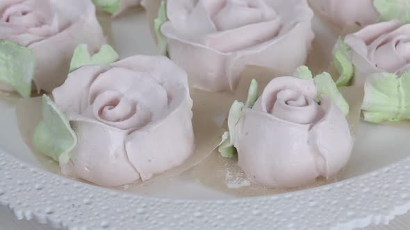 Homemade Marshmallows. Zephyr In The Form Of Flowers With Green Leaves. Spins With A Tray. Close Up alt
