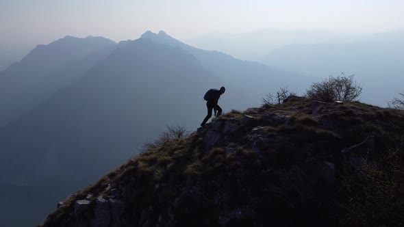 Hiker on top of the mountain, Lake Como, European Alps, Italy alt
