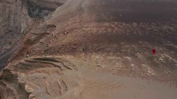 Man Running on Hills of Capelinhos Volcano Faial Island Azores Portugal alt