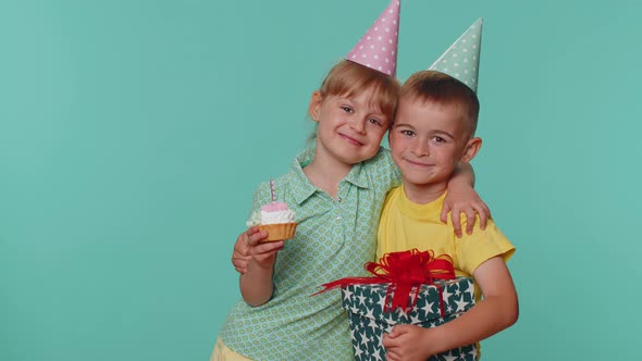 Happy Children Boy Girl Siblings Friends Celebrating Birthday Blowing Candle on Cake Making a Wish alt