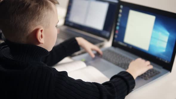 Footage of Two Little Boys Trying to Learn Programming alt