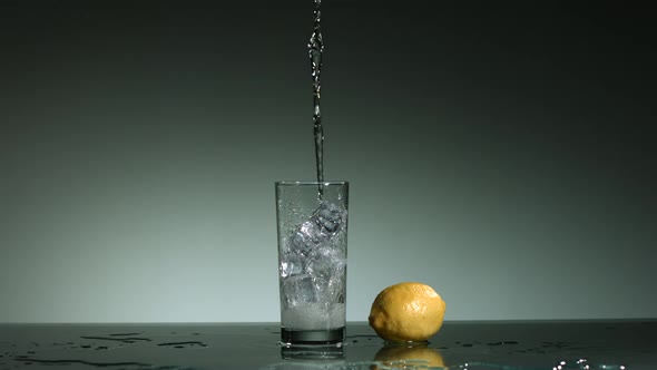 Carbonated liquid pouring into glass filled with ice - ultra slow mo 1500fps - LIQUID POUR  alt