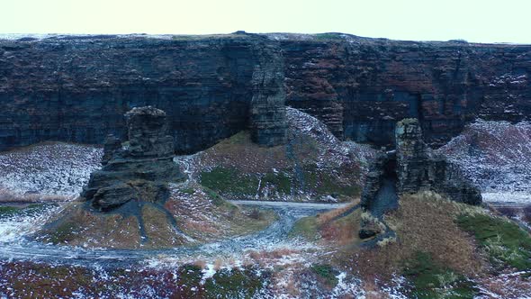 Rybachy Peninsula, Russia, Dva Brata. Weathered rock formations "Two Brothers".
