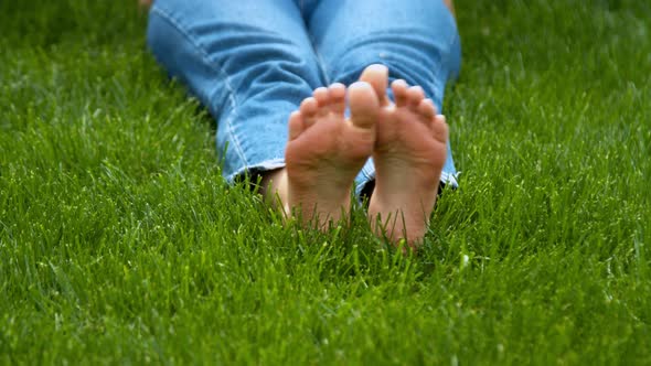 Woman Lying on Green Grass