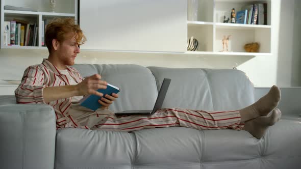 Freelancer Making Notes Browsing Web on Weekend alt