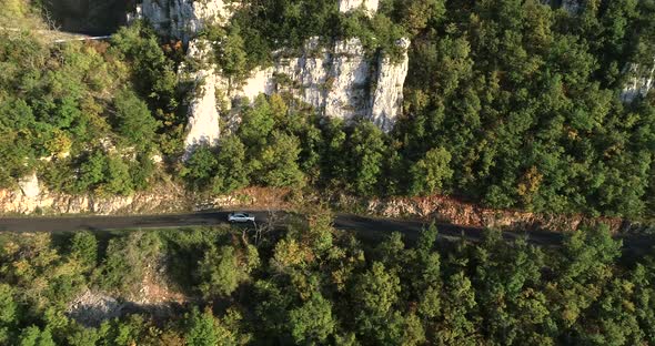 Aerial Car Travels in Beautiful Mountainous Terrain