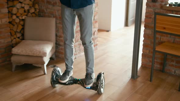 Businessman on Hoverboard Scooter Comes To Startup Office and Greeting Coworkers