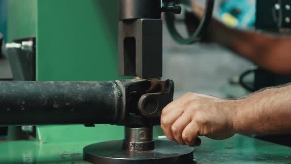 A Locksmith Repairing a Gimbal alt