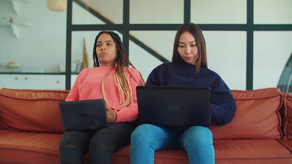 Multiethnic Female Students Studying Together Indoors alt
