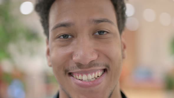 Close Up of Face of African American Man Smiling at the Camera alt