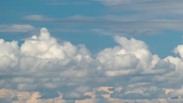 Time Lapse Footage of Fast Moving White Puffy Cumulus Clouds on Blue Clear Sky alt