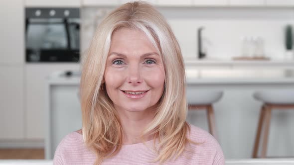 Closeup of Happy Mature Middle Aged Woman Looking at Camera Posing at Home Apartment Portrait of alt