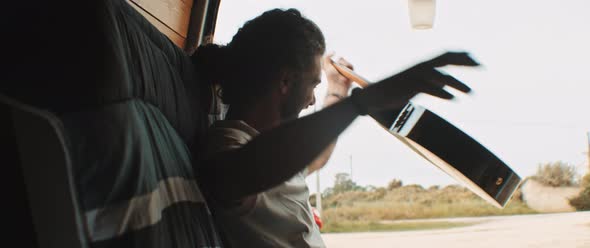 Young man having fun and playing the guitar alt
