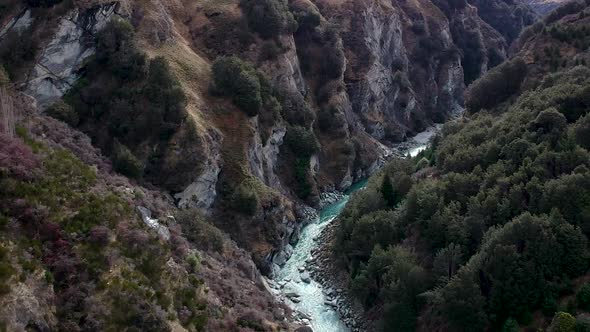 Aerial reveal of Skippers canyon and Shotover River in Queenstown, Central Otago, New Zealand alt