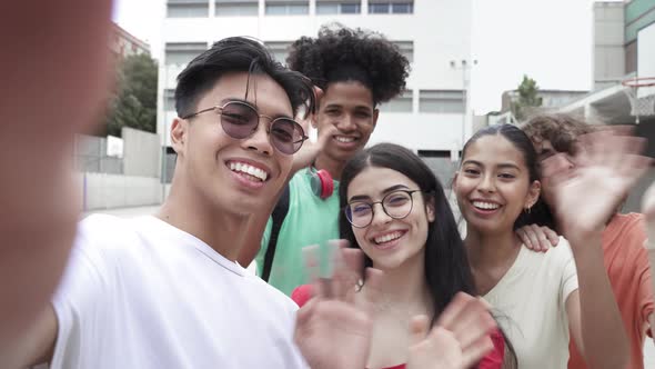 Asian Young Guy and Group of Multi Ethnic Teenager Friends Taking Selfie Photo with Phone Looking alt