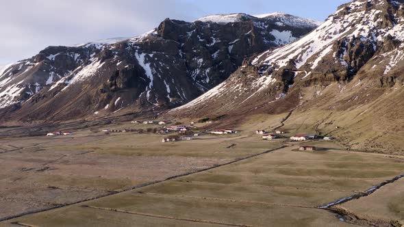 Small Settlement With Mountainous Backdrop in the Winter alt