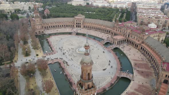 People at Spain Square or Plaza de Espana in Maria Luisa Park, Seville in Spain. Aerial reverse