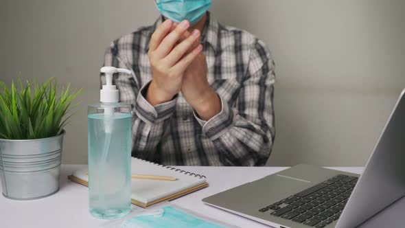 Man Clean Hands with Alchohol Gel to Protect Against Coronavirus or COVID19 alt