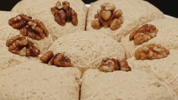 Sweet Turkish Dessert Halva Block with Nuts Closeup