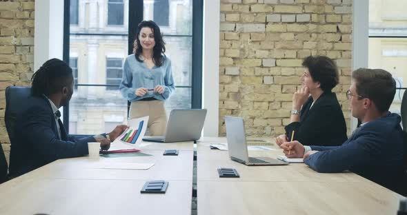 Beautiful Young Confident CEO Leading Business Meeting in Office. Portrait of Smiling Gorgeous alt