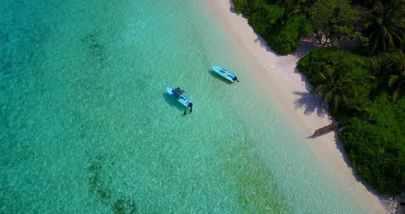 Wide angle aerial abstract view of a sandy white paradise beach and turquoise sea background in 4K alt