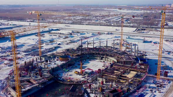 Building Process of Sports Stadium with Tower Cranes alt