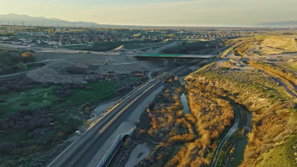 Aerial - Circle Pan Shot over Railroad and Jordan River in Bluffdale Utah alt