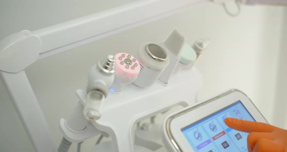 Beauty Clinic Concept. Choosing A Manipulator For Cleansing Facial Skin alt