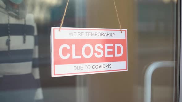 Sign We Are Open After Covid. We Are Open Sign on the Glass Door alt