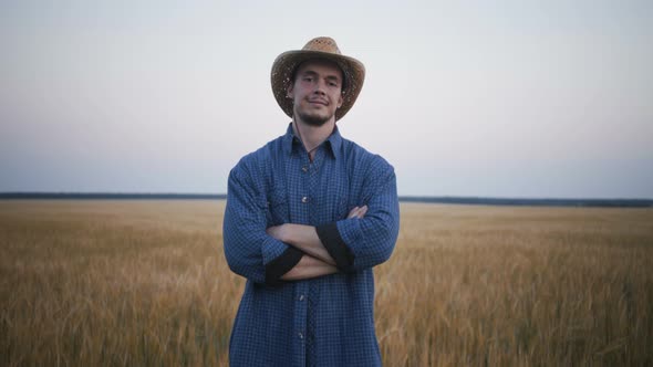 Footage Portrait of Young Farmer in the Field. alt