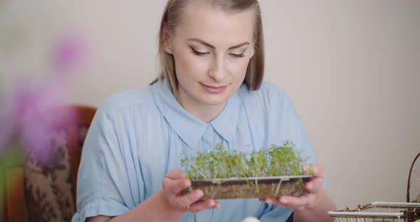 Happy Easter - Woman Holding Cuckooflower in Hands alt