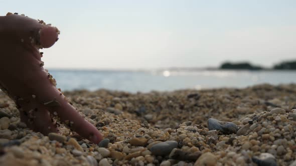 Female Hand Digging and Taking Sand on a Seashore in Turkey at Sunset in Slo-mo 