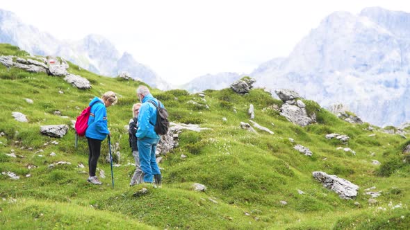 Family Excursion Along a Beautiful Mountain Landscape alt