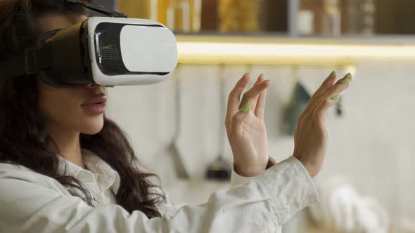 Biracial Young Woman in Goggles Examines Virtual Reality alt
