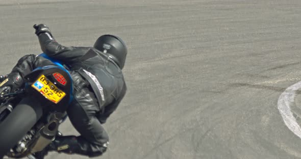 Slow motion of sport motorcycles making turns during a race alt