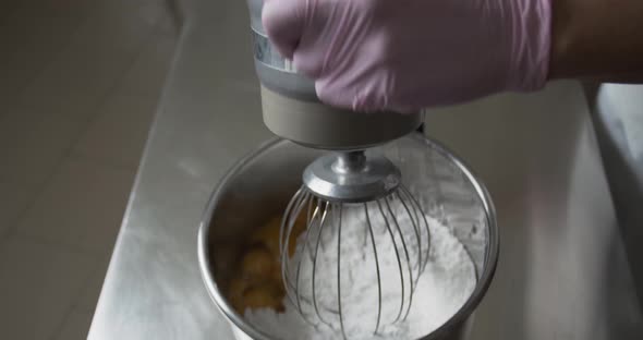 Dough Mixer is Working on Some Gingerbread Dough Mixing Eggs and Flour alt