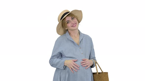 Pregnant Woman in Summer Standing and Touching Her Belly on White Background. alt
