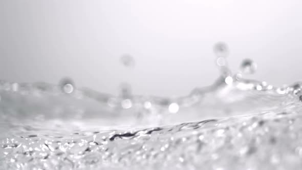 Slo-motion grapes rolling through water alt