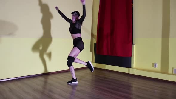 Sexy Dancing  Adult Blonde Woman in Translucent Suit and a Cap Dancing in Yellow Studio alt